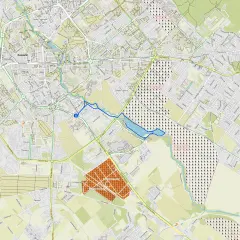 Mapa Koszalina z zaznaczonym osiedlem Gnieźnieńska. Widoczne ulice, parki i budynki.