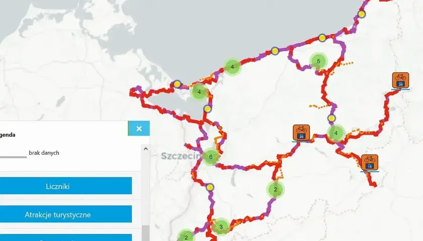 Mapa rowerowa z zaznaczonymi trasami wokół Szczecina i wybrzeża. Widoczne punkty z atrakcjami turystycznymi i ostrzeżeniami.