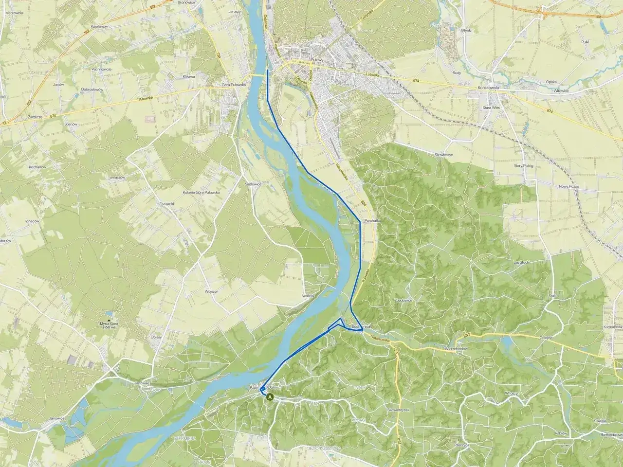 Mapa drogowa z zaznaczoną trasą z okolic Warszawy do Kazimierza Dolnego, ukazująca Wisłę i tereny zielone.